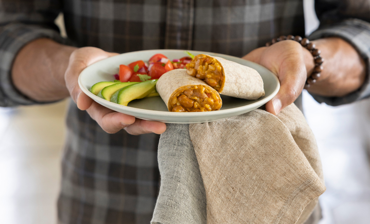 Amy’s Burrito on a plate with salsa and avocado slices